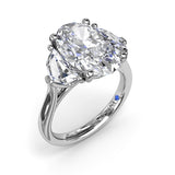 Three Stone Oval and Cadillac Engagement Ring