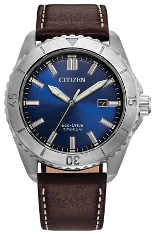 Citizen watch with blue dial and brown leather strap on a white background