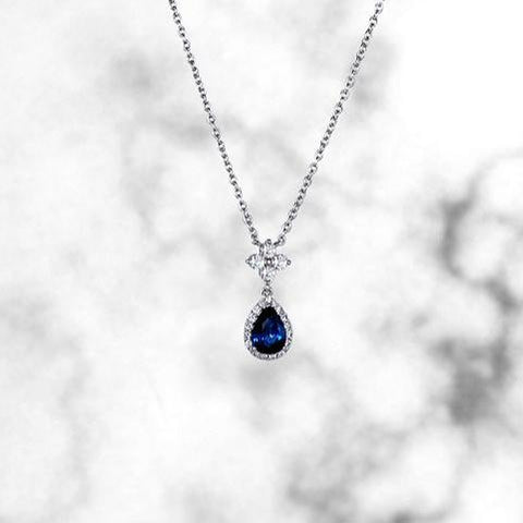 pear shape blue sapphire pendant with quatrefoil of diamonds 