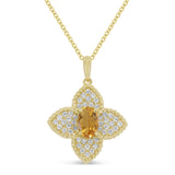 A yellow gold pendant with an oval citrine and round diamonds, attached to a chain.