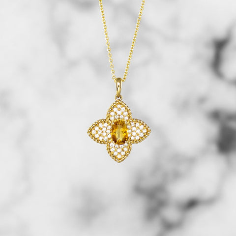 Gold quatrefoil diamond pendant with oval citrine on gold chain